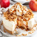 Apple crumble cheesecake with a golden crumble topping and creamy filling.