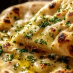Freshly baked artisan garlic naan served warm and fluffy