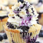 Blueberry cream cheese cupcakes decorated with fresh blueberries and frosting