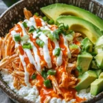 Buffalo Chicken Cottage Cheese Bowl topped with fresh ingredients