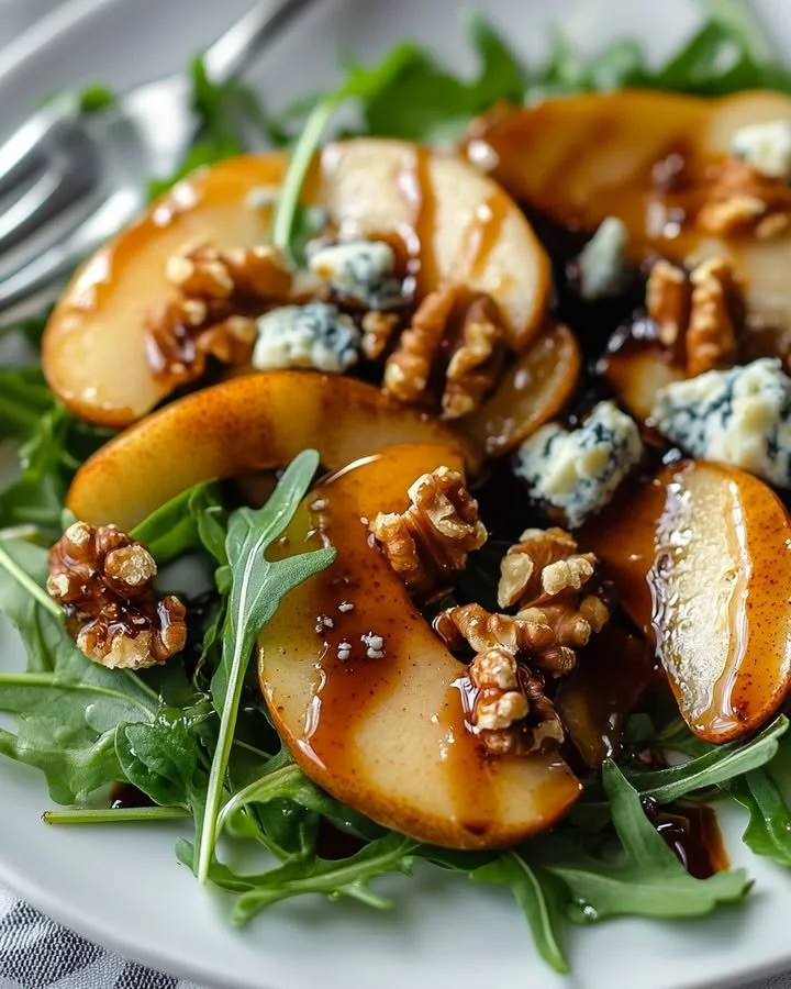 Delicious caramelized pear and blue cheese salad with mixed greens