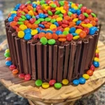 Chocolate M&M Celebration Cake with colorful candies and rich frosting