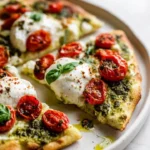 Cottage cheese flatbread topped with fresh summer vegetables and herbs.