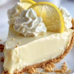 Cream Cheese Lemonade Pie topped with fresh lemons and whipped cream