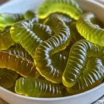Dill Pickle Gummy Worms in a colorful packaging