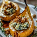 Elegant blue cheese stuffed pears served on a plate as a gourmet appetizer