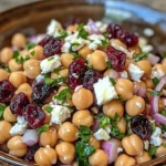Feta and cranberry chickpeas salad drizzled with lemon vinaigrette