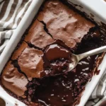 Gooey sourdough chocolate cobbler topped with chocolate sauce and served warm.