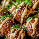 Delicious Korean BBQ Meatballs served with a spicy mayo dip on a plate.
