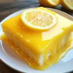 Slice of Lemon Sunshine Glaze Cake with a vibrant lemon glaze