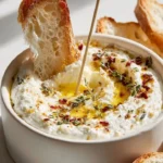Delicious melting candle ricotta dip with herb-garlic butter flame