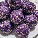 No-bake lemon blueberry protein bites on a plate
