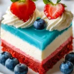 No Bake Patriotic Cheesecake topped with red, white, and blue berries.