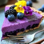 Delicious no-bake vegan blueberry chia seed pie on a wooden table.
