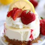 No-bake strawberry lemon cheesecake slice on a plate with fresh strawberries.