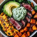 Steak bowl with avocado, roasted corn, and cilantro cream sauce served in a bowl