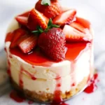 Delicious strawberry shortcake cheesecake topped with fresh strawberries