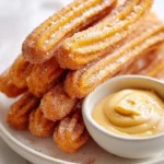 Sweet potato churros served with salted caramel goat cheese dip