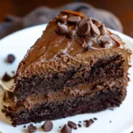 Decadent triple chocolate cake with layers of rich chocolate frosting and decorations